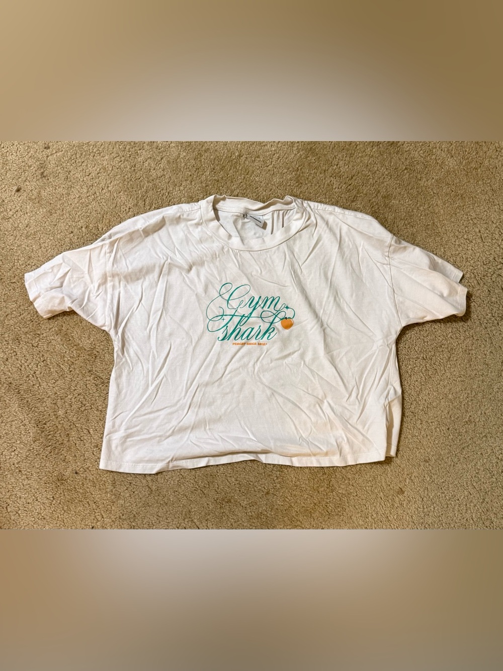 Gymshark White Short Sleeve Crop Tee with Teal Script and Peach Accent